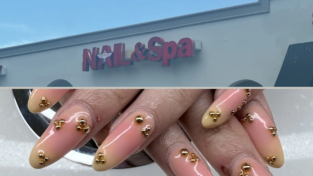 Acrylic nails being shaped at a salon table.